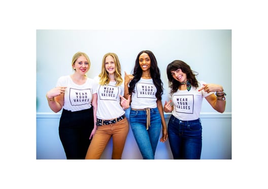 Four ladies with printed t-shirts showing Wear Your Values